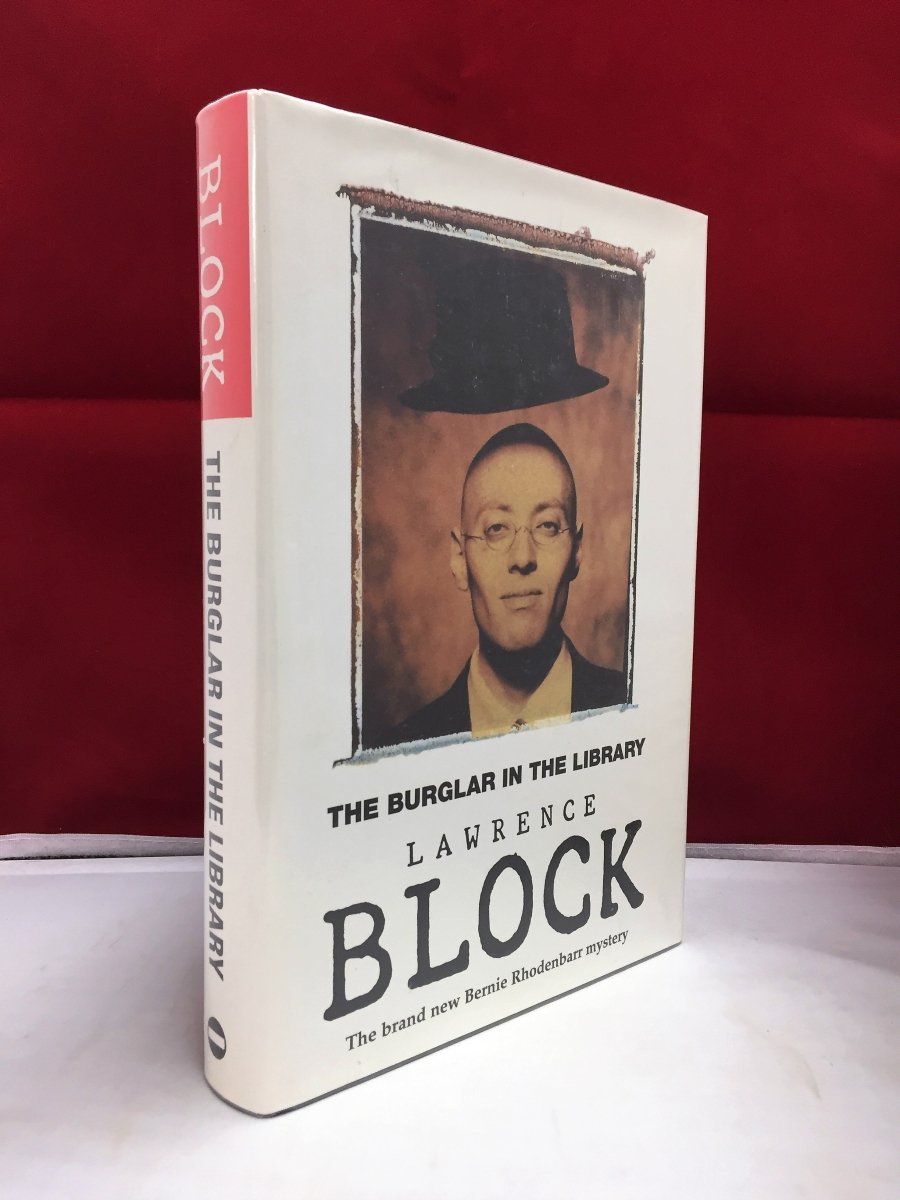 Block, Lawrence - The Burglar in the Library | front cover. Published by No Exit Press in 1997. Hardcover.  Condition:  Near Fine ++/Near Fine ++