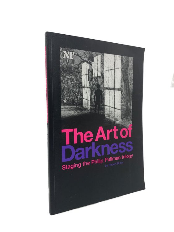 Robert Butler Signed First Edition | The Art of Darkness : Staging The Philip Pullman Trilogy | Cheltenham Rare Books. Published by National Theatre in 2004. Paperback.  Condition:  Near Fine/No Jacket ( as Issued )