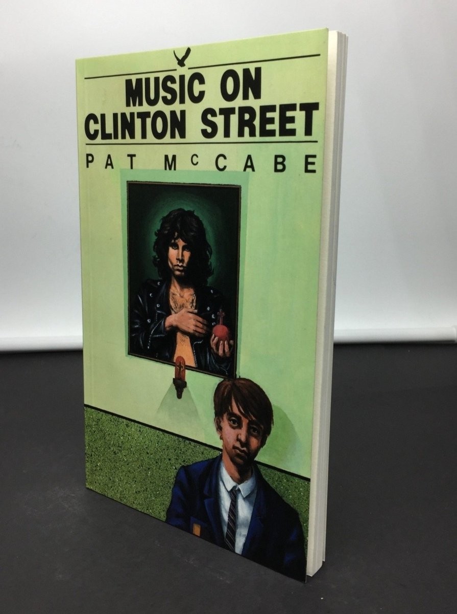 McCabe, Pat - Music on Clinton Street - SIGNED | front cover. Published by Raven Arts Press  in 1986. Paperback.  Condition:  Fine/No Jacket ( as Issued )