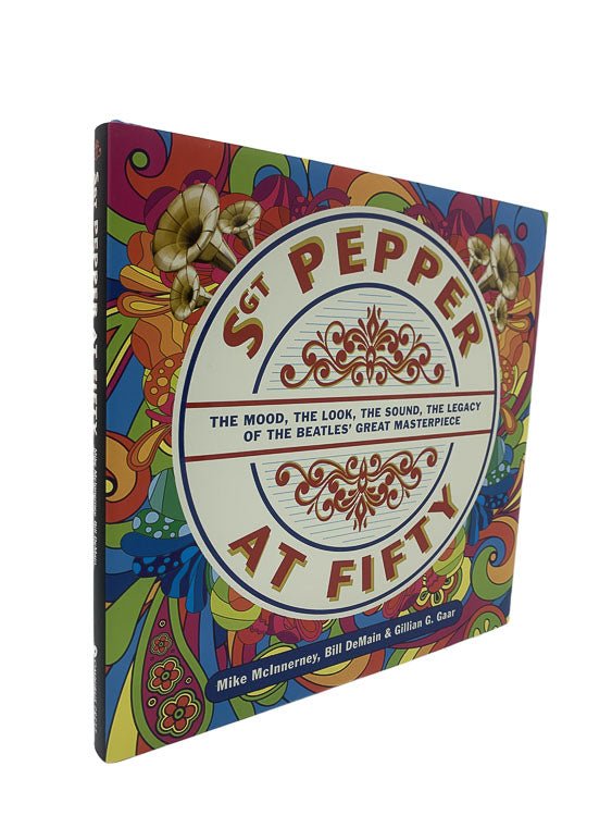 Mike McInnerney; Bill DeMainj; Gillian Gaar First Edition | Sgt. Pepper at Fifty : The Mood, the Look, the Sound, the Legacy of the Beatles' Great Masterpiece | Cheltenham Rare Books. Published by Omnibus Press in 2017. Hardcover.  Condition:  Fine/Fine