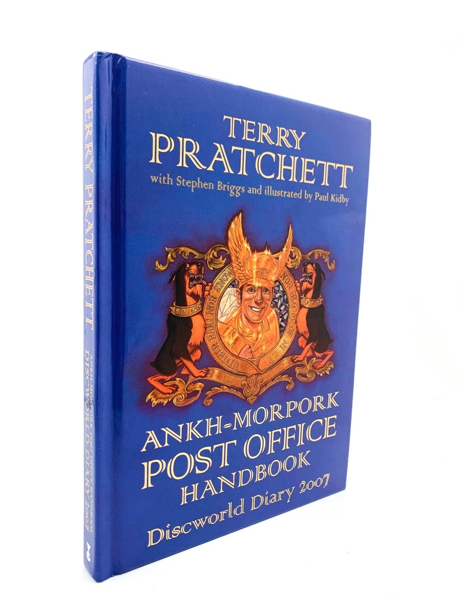 Pratchett, Terry - Ankh-Morpork Post Office Handbook 2007 | front cover. Published by Victor Gollancz Ltd in 2006. Hardcover.  Condition:  Near Fine ++/No Jacket ( as Issued )
