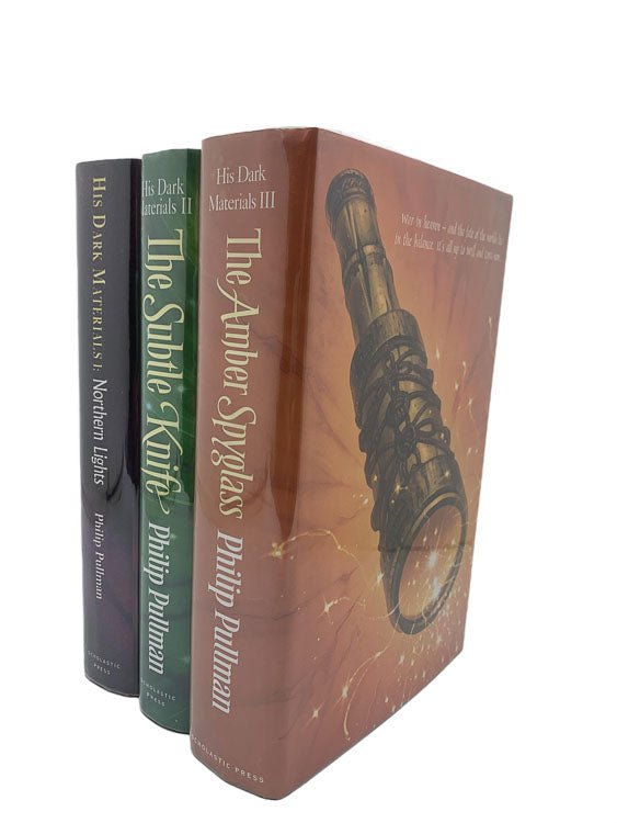Philip Pullman Signed Collectable Book | His Dark Materials : Northern Lights, The Subtle Knife, The Amber Spyglass - Tenth anniversary SIGNED SLIPCASED Collector's Edition. | Cheltenham Rare Books. Published by Scholastic in 1995. Hardcover.  Condition:  Near Fine/Near Fine +
