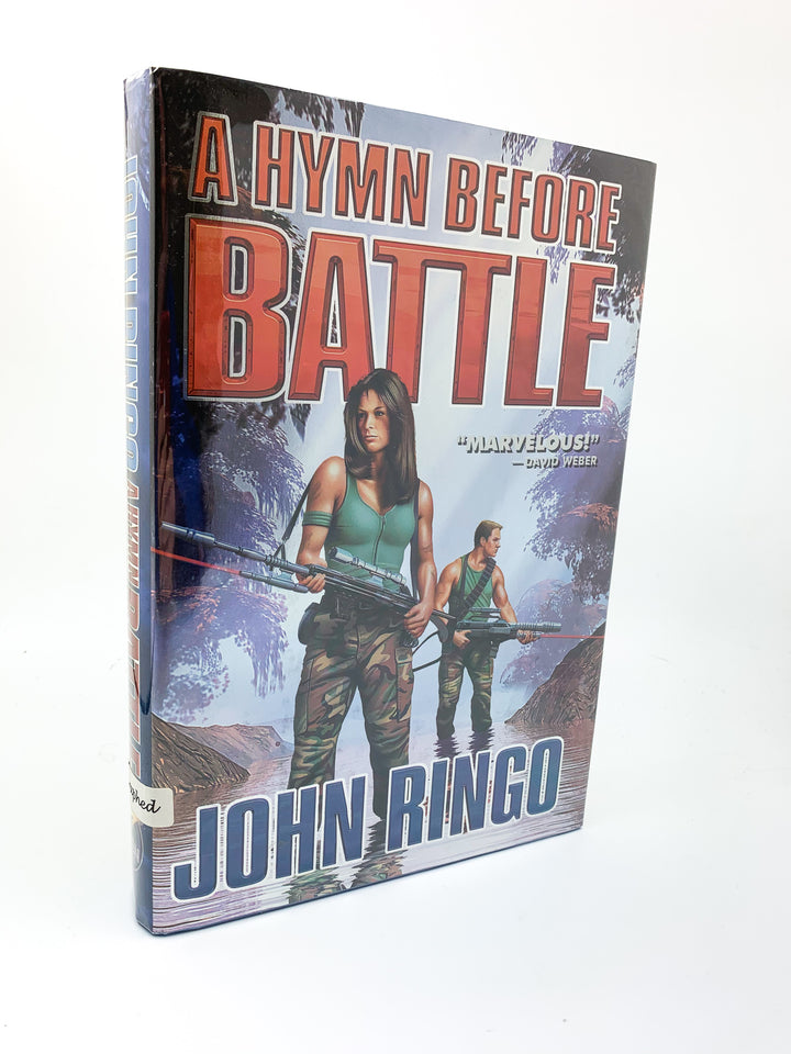 Ringo, John - A Hymn Before Battle - SIGNED | front cover. Published by Baen in 2000. Hardcover.  Condition:  Very Good +++/Near Fine +