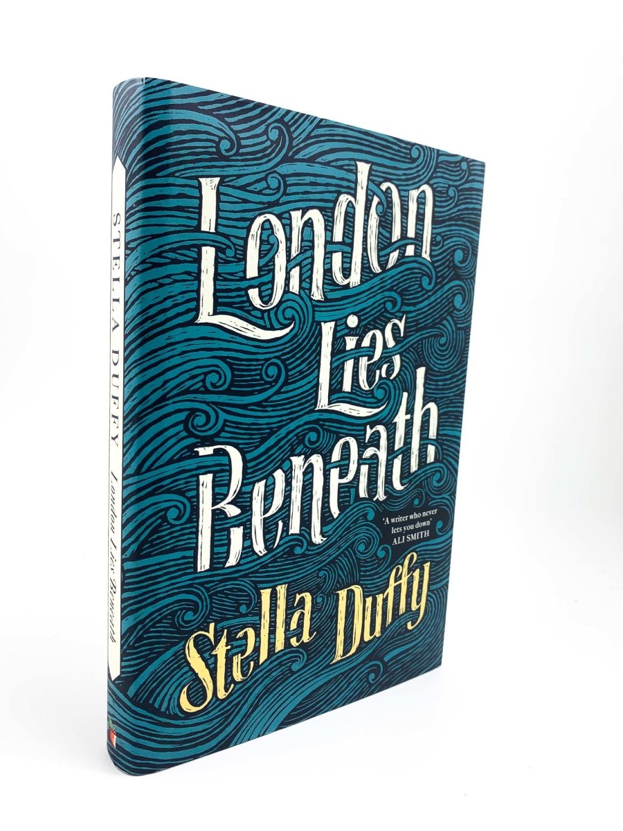 Duffy, Stella - London Lies Beneath | front cover. Published by Virago in 2016. Hardcover.  Condition:  Fine/Fine