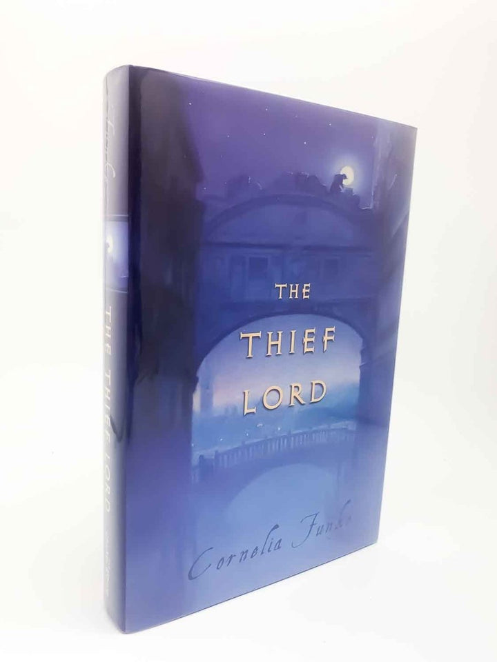 Funke, Cornelia - The Thief Lord | front cover. Published by Chicken House in 2002. Hardcover.  Condition:  Very Good ++/Fine
