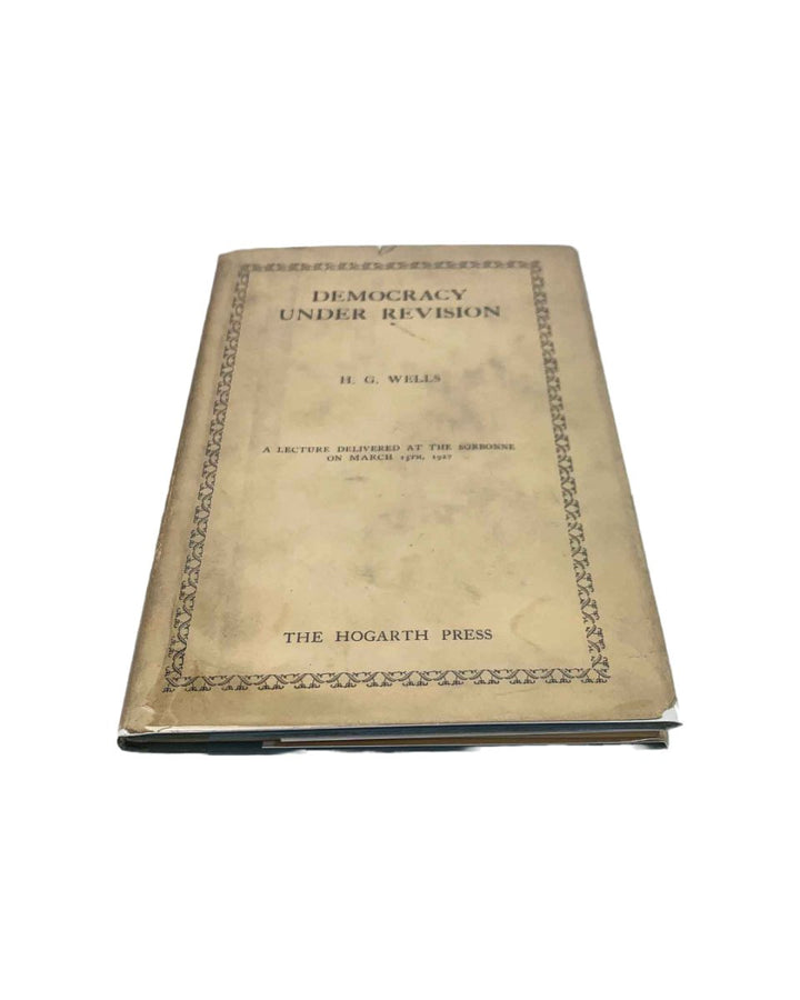 Wells, H G - Democracy Under Revision | front cover. Published by Hogarth Press in 1927. Hardcover.  Condition:  Very Good ++ / Near Fine/Very Good